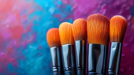 A row of makeup brushes are displayed on a blue background