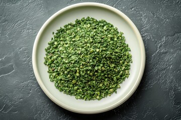 Bowl of green peas on a dark slate surface