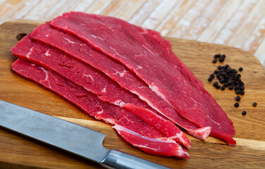 Image of a juicy raw beef fillet cut into pieces...