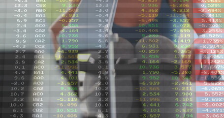 Image of financial data processing over diverse caucasian woman exercising at gym