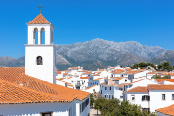 Fototapeta premium A small town with a white church and houses with red roofs