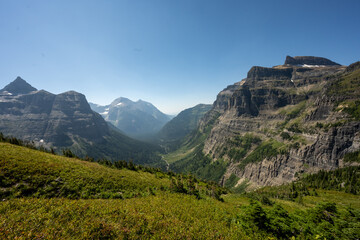 Wall Below Boulder Pass Stands Out Among The Bright Green Valley Below
