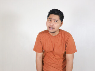 asian man looking sluggish, tired, and dissapointed with situation