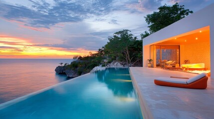 Fototapeta premium Stunning Sunset Over Private Infinity Pool at Exclusive Coastal Villa Retreat
