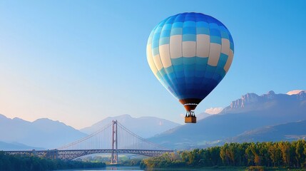 Blue and White Hot Air Balloon Over Mountain Landscape