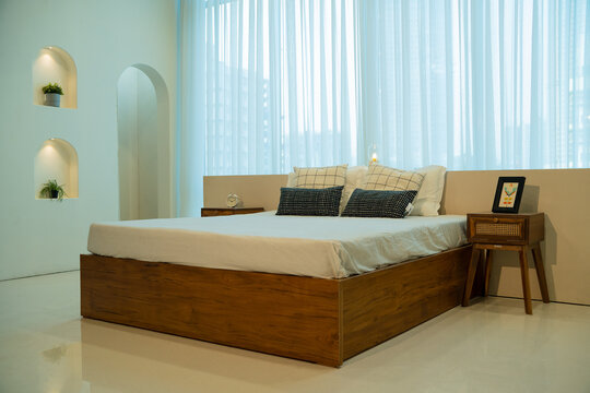 bed in asthetic ambience with Backlight with curtains in background