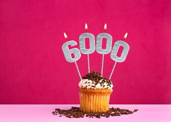 Candle number 6000 - Number of followers or likes.