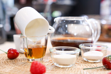 Cake Ingredients Glass jars of oatmeal and yellow honey,Dripping honey,Tea