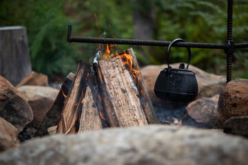 open fire flames boil kettle drink orange 