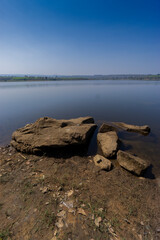 Modern reservoir construction and maintenance Asia. Clean water project for rural areas, showing environmental impact