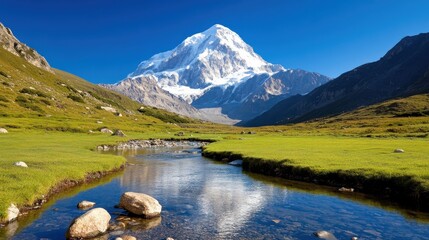 Majestic snow-capped mountains and a serene river in a vibrant valley