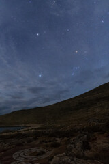 Old mosaic in ruin of ancient Roman baths at Cape Matapan or Tainaron during night time with stars of Orion constellation, Mani, Peloponnese, Greece