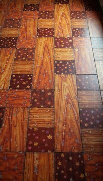 Warm wooden floor with colorful parquet pattern, flooring, colorful background, interior