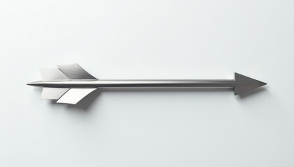 Metallic arrow resting on pristine white surface, sharp, arrow