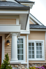 Elegant Home Exterior: Classic Columned Porch and Beige Facade