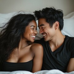 Mixed couple, black woman and asian man smiling at each other in bed. Square photography