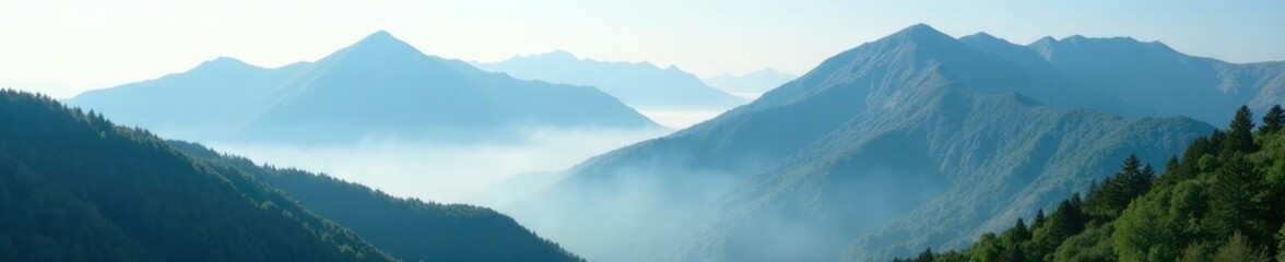 Fototapeta premium Misty mountain peaks shrouded in clouds and green forests, tree lined, forests