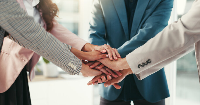 Hands, huddle and team building with business people in office together for solidarity or unity. Collaboration, motivation and stack with employee group in workplace for celebration or success