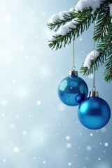 Radiant blue glass baubles suspended from a gleaming metal wreath against a snowy white backdrop, snow, white background, christmas wreath