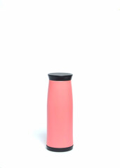 Pink hot drink tumbler or thermos isolated on a white background. Hot water bottle for lunch. Copy space for text. For graphic design or banner background. Plain bottle for mockup design