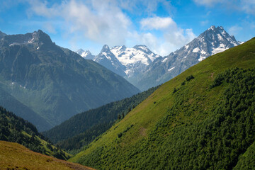 Obraz premium View of the peaks of the North Caucasus mountains near the Arkhyz ski resort on a sunny summer day, Karachay-Cherkessia, Russia