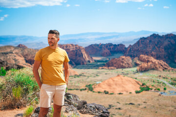 Young hiker man on his way in National Park in Utah. Man with in Zion national park