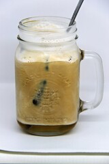 Jasmine Iced Coffee. Made from premium Arabica beans and infused with the subtle sweetness of jasmine, this chilled beverage offers a smooth and invigorating taste.