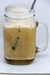 Jasmine Iced Coffee. Made from premium Arabica beans and infused with the subtle sweetness of jasmine, this chilled beverage offers a smooth and invigorating taste.