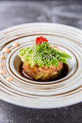Gourmet tuna tartare with avocado and microgreens