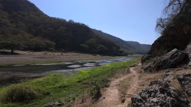 A refreshing oasis at Wadi Darbat, Oman near Salalah with flowing fresh water