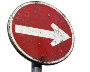 Red circular keep right sign with white arrow pointing right, showing signs of wear and dirt, indicating direction for vehicles