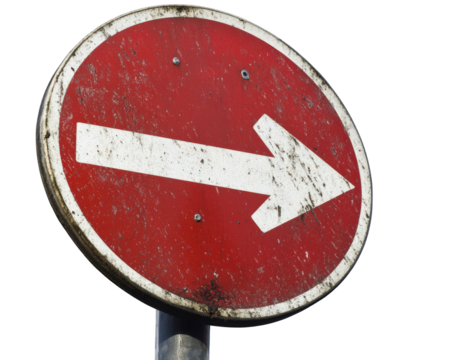 Red circular keep right sign with white arrow pointing right, showing signs of wear and dirt, indicating direction for vehicles