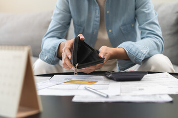 Debt financial concept, stressed problem asian woman hand open empty wallet, purse not have budget...