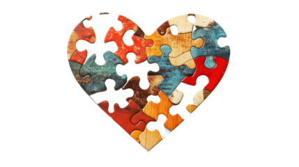 Colorful puzzle pieces forming a heart shape on transparent background