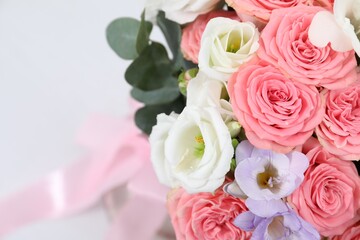 Beautiful wedding bouquet on light background, closeup. Space for text