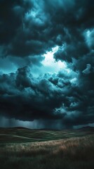 Obraz premium A stormy sky with dark clouds and a bright sun peeking through. Scene is ominous and foreboding