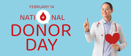 Female doctor with paper heart pointing at something on blue background. Blood donation concept