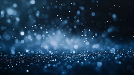 White snowflakes floating sparsely on a rich dark blue background, creating a calm and serene winter night feel, leaving ample blank space at the top for advertisements or logos
