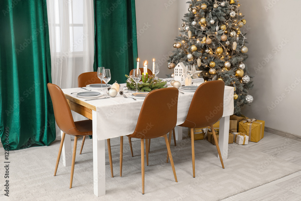 Wall mural Festive table setting with burning candles and Christmas decorations in elegant dining room