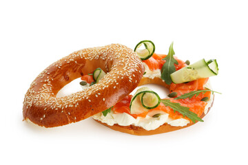 Delicious bagel with salmon, cream cheese and cucumber isolated on white