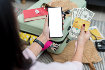 Mobile phone screen mockup, smartphone display mock-up and money, dollars. Mature woman packing.