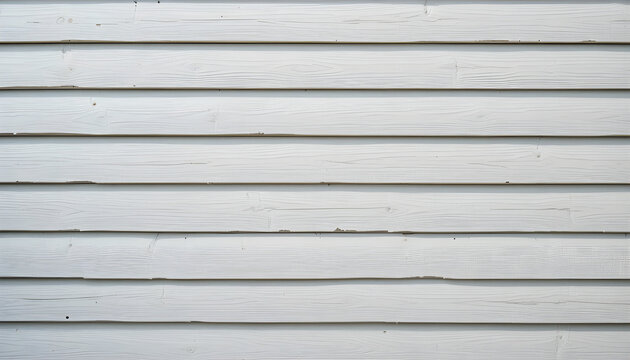 Close-up of a weathered white wood siding