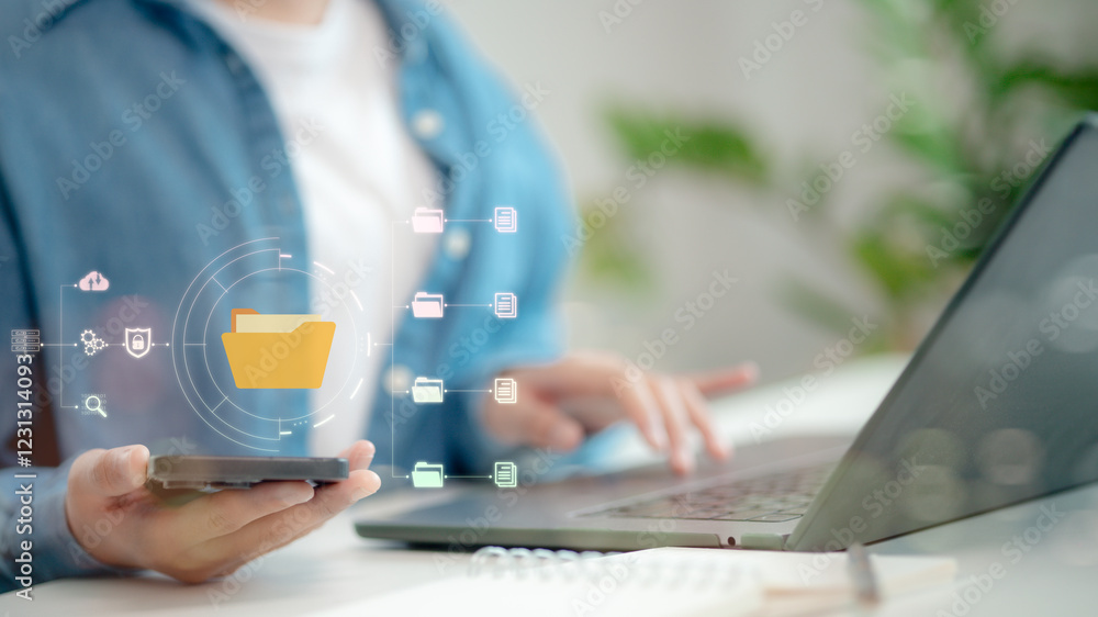 Aufkleber document management system (dms) being set up by it consultant working on laptop computer in the off