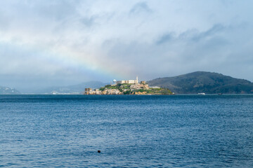 Prison of Alcatraz in sunlight with a rainbow on a party sunny day, San Francisco California