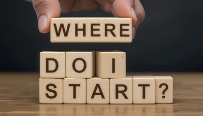 Wooden blocks spelling out the question 'Where do I start?'  A hand holds the 'WHERE' block above the rest.