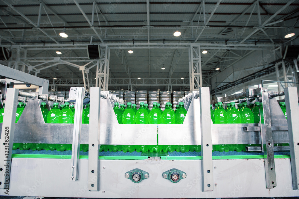 Poster bottling process of green soda drinks in a modern factory setting with multiple production lines ope