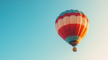 Fototapeta premium Vibrant hot air balloon isolated on white background for creative design projects and travel theme visual content.