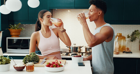 Couple, drinking and juice for breakfast at house of healthy meal, nutrition diet and bonding...
