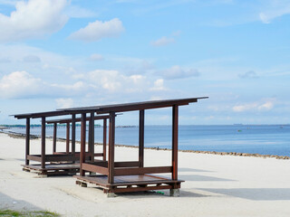 Fototapeta premium The relaxation hut at the white sand beach or pantai pasir putih at PIK 2 in Jakarta, Indonesia