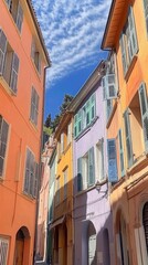 Fototapeta premium Charming narrow street lined with colorful houses under bright b